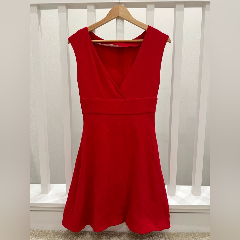 Miu Miu            
Bust:  15 in
Waist:  12.5 in
Hip:     13.5 in
Length:	34 in